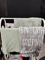 personalized minky blanket with Griffin written on it on a blanket holder