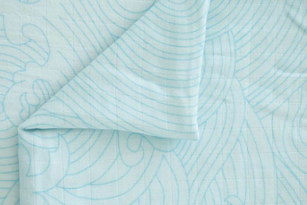 Close-up of light blue fabric with subtle pattern