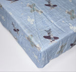 cartoon airplanes on a cotton bamboo material - planes are flying through the air with whimsical clouds and stars