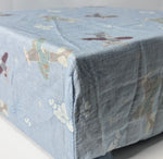 Cotton Bamboo Muslin crib sheet with adorable planes using pastel blue hues and natural colors