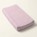 Pink Crashing Sea Waves changing pad cover on a long rectangular changing pad against a clean background